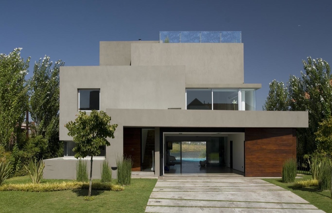 Fachada de casa moderna gris con vista al interior
